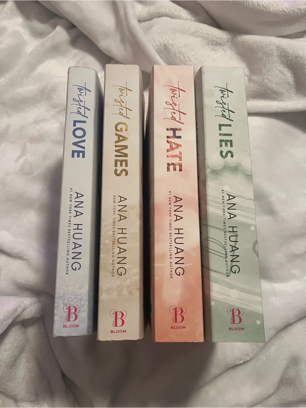 Set of 4 Decorative Book Spines in Blue, Gold, Pink, and Green